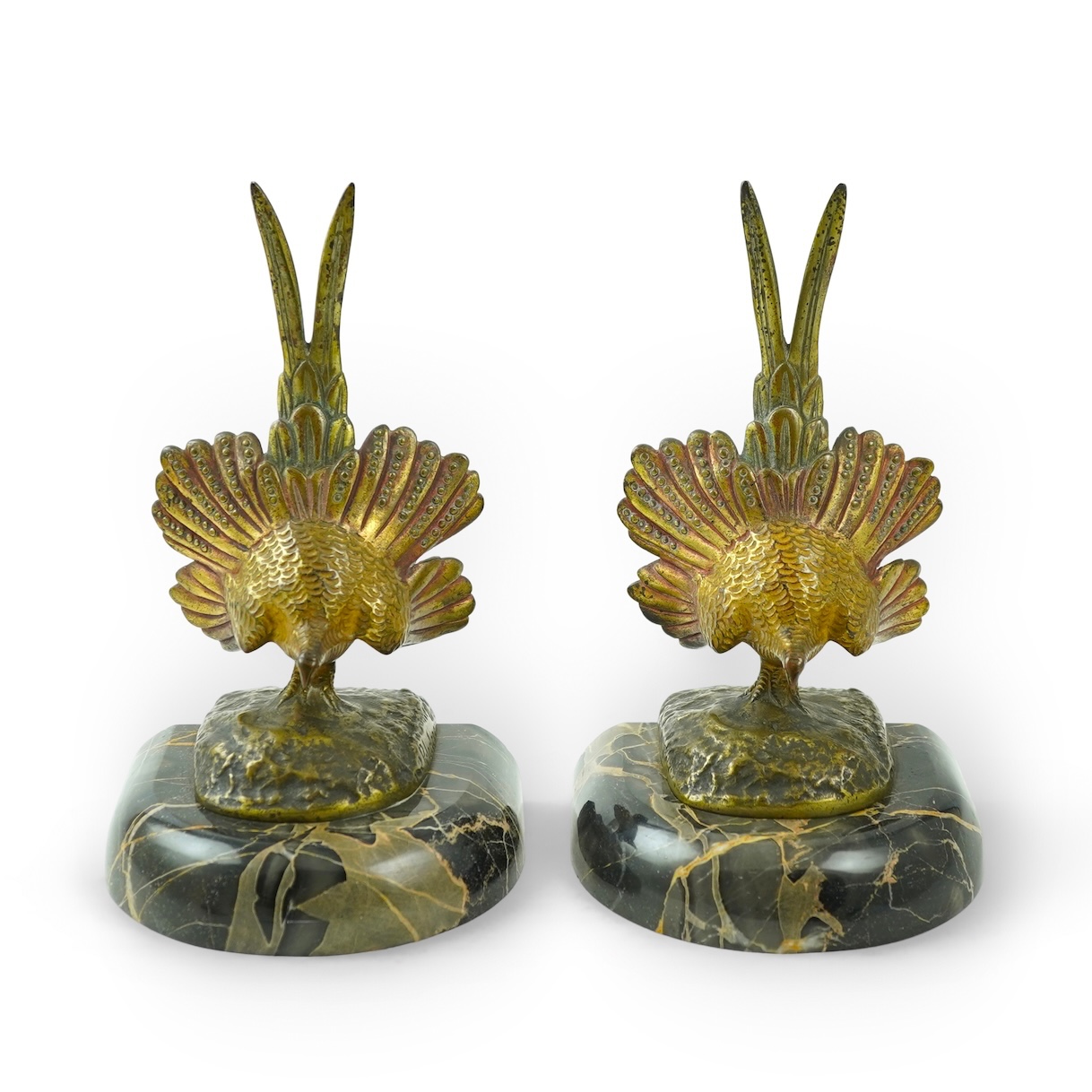 A pair of bronze peacock bookends, with remains of coloured pigments, marble plinths, signed R. Leclerc, 20cm